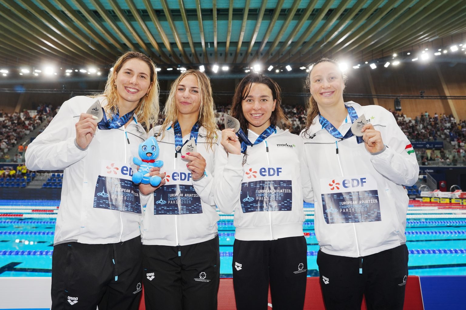 PARIS, FRANCE - August 10, 2026: Silver medalists PADAR Nikolett, ABRAHAM Lilla Minna, KESELY Ajna and UGRAI Panna (HUN) pose on the podium during the medal ceremony for the Women's 4x200m Freestyle at the European Aquatics Championships Paris 2026 on August 10, 2026 in Paris, France. (Photo by Istvan Derencsenyi/European Aquatics)